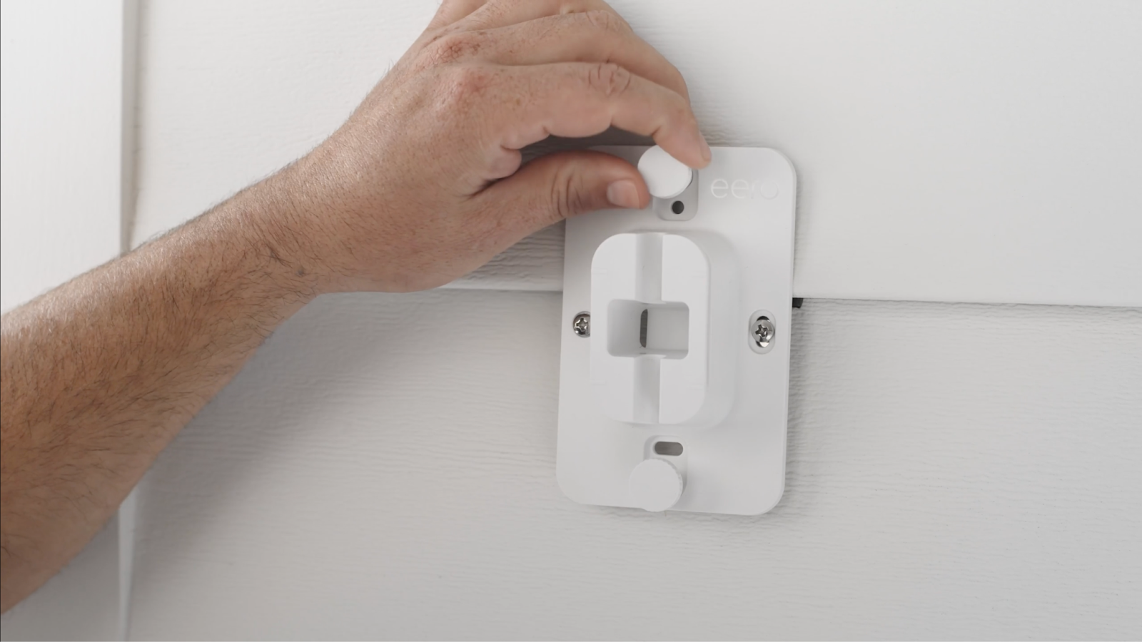 inserting leveling screws into mountain bracket