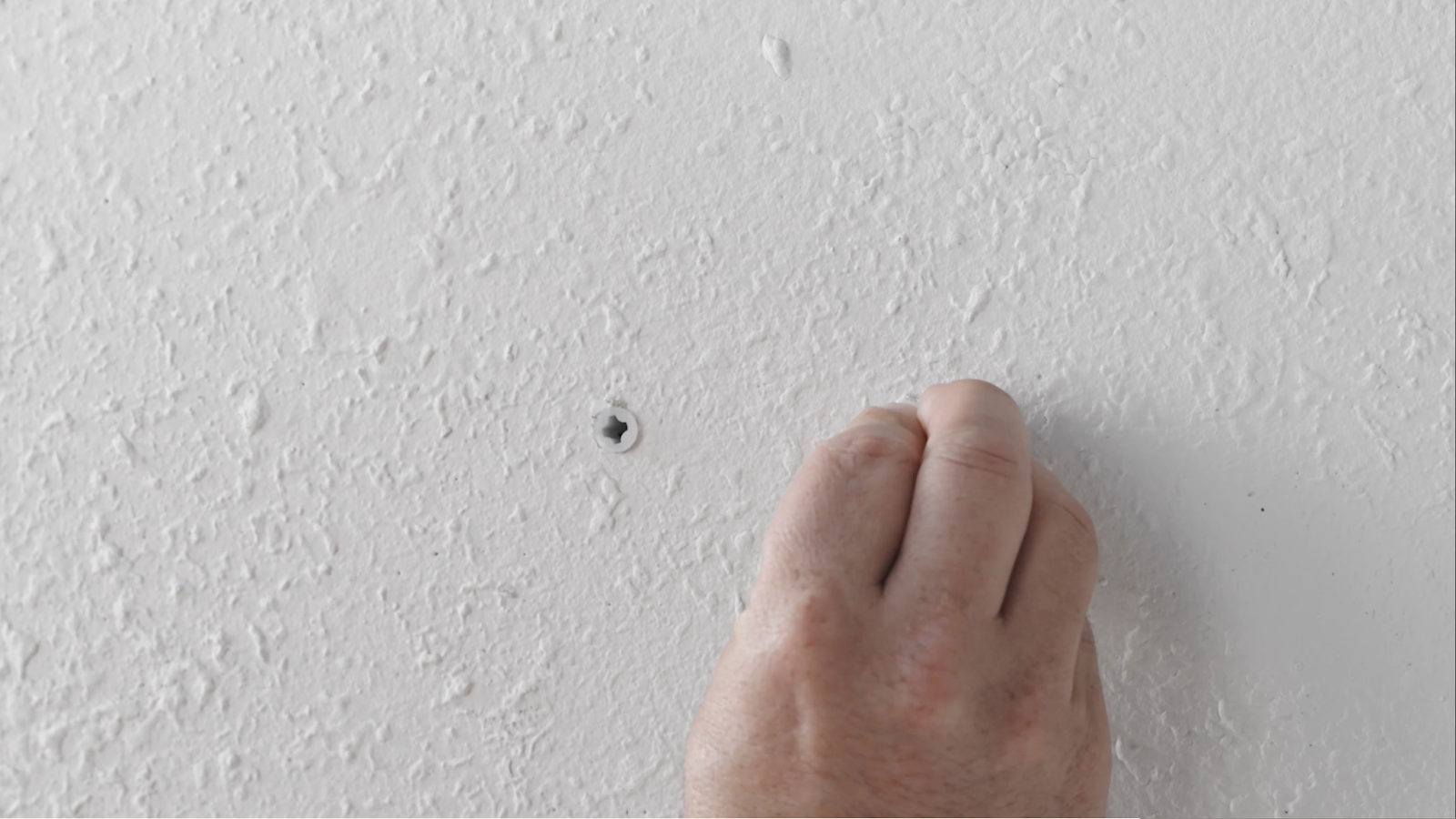 inserting drywall anchors